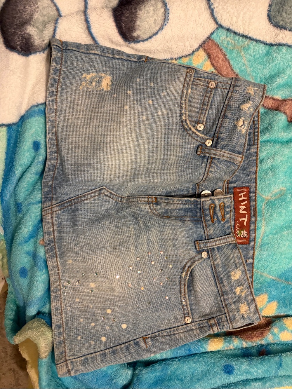 Hunt Light Wash Distressed Denim Mini Skirt with Stud Accents